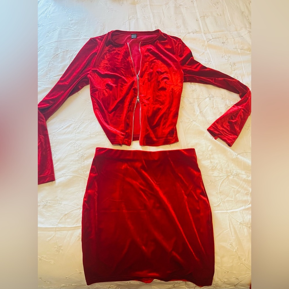 Red velvet set piece. Long sleeve zip crop top with a mini skirt. Size small